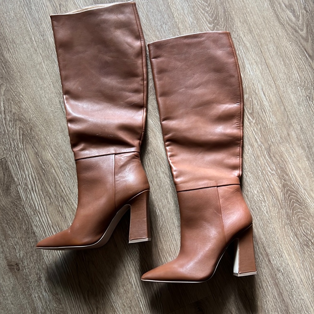 Womens Steve Madden heeled boots. Never worn still in box.